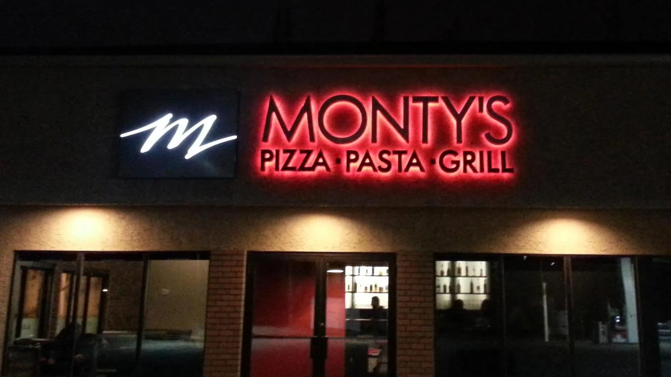 Exterior of Monty's Pizza pizza and steakhouse on Potter Greens Dr NW in Edmonton, AB