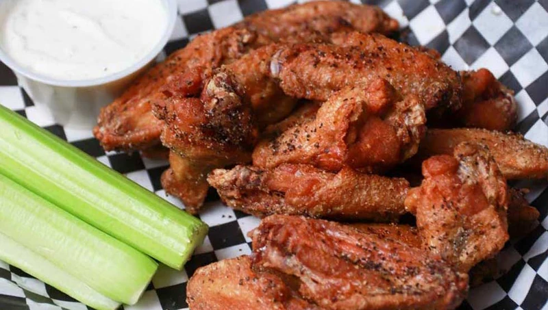 Saucy chicken wings shared at Monty's Pizza in west Edmonton, AB