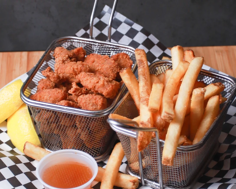 Seasoned dry ribs fried crisp and served with plum sauce at Monty's Pizza in Edmonton, AB