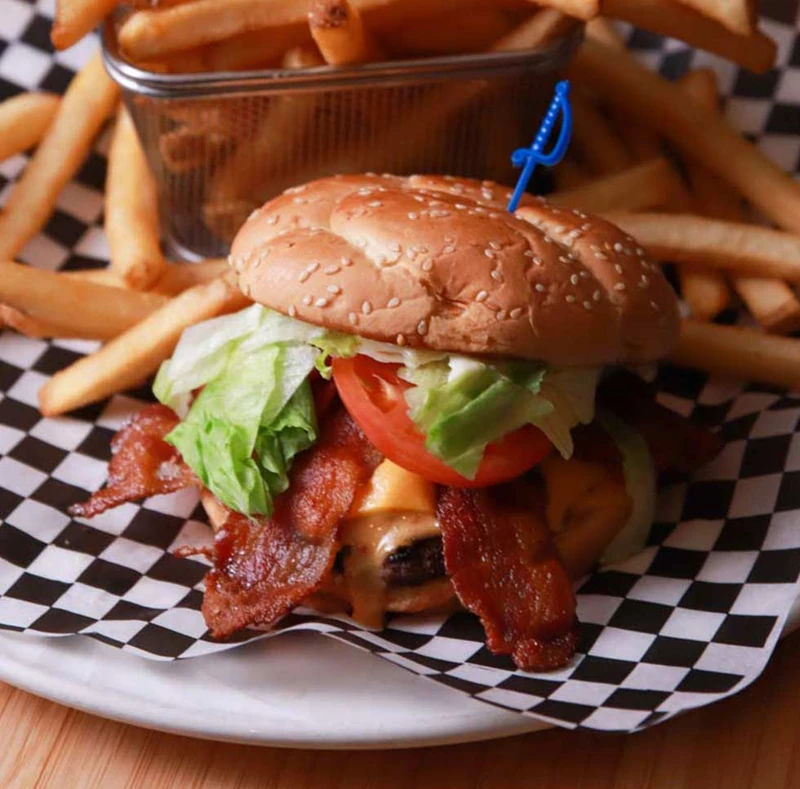 Charbroiled burger with fries at Monty's Pizza and steakhouse in Edmonton, AB