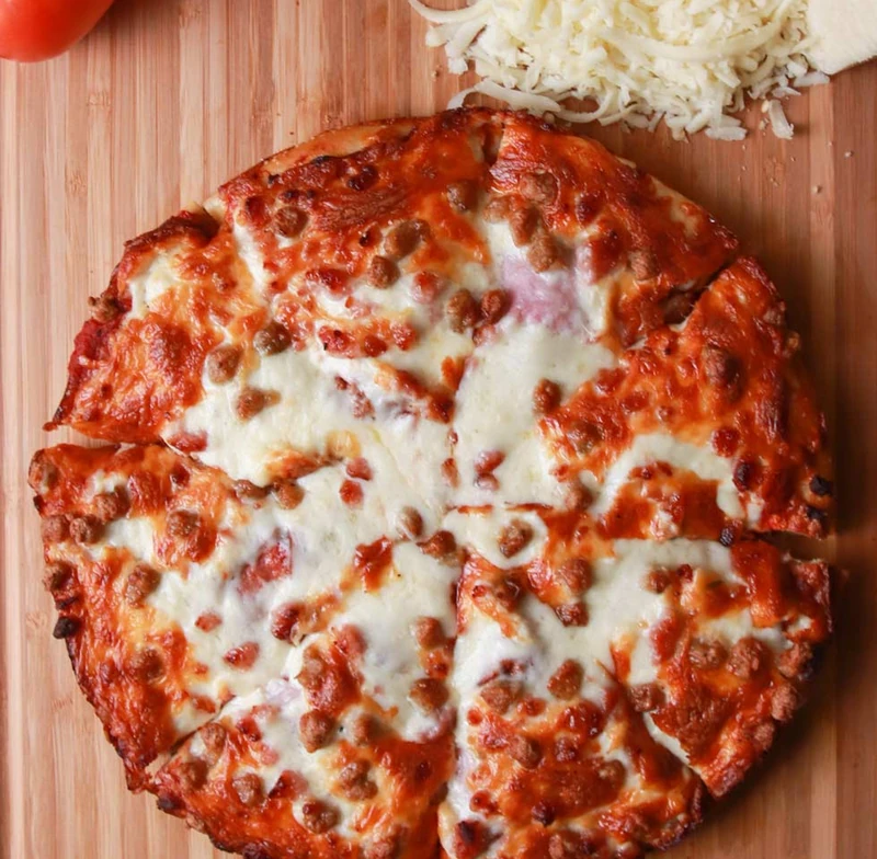 Meat Lovers pizza loaded with pepperoni, ham, beef and sausage in Edmonton, AB