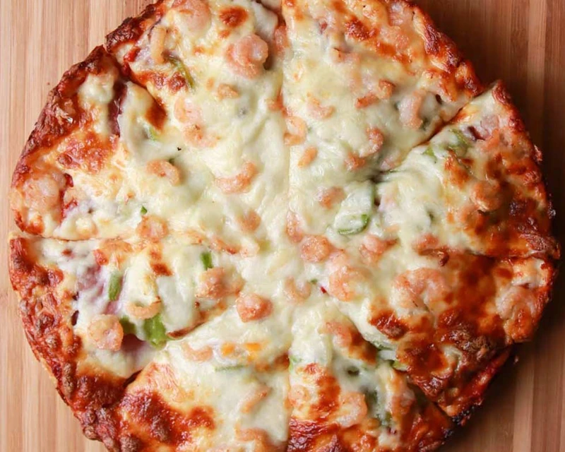House Special pizza with ham, pepperoni, mushroom, green pepper, onion and shrimp at Monty's Pizza in Edmonton, AB